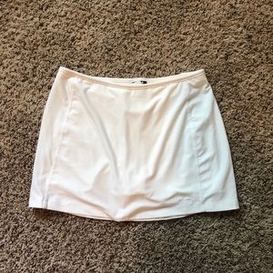 (2) white tennis skirts